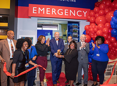 A photo shows an emergency room storefront for Johns Hopkins at Biztown.